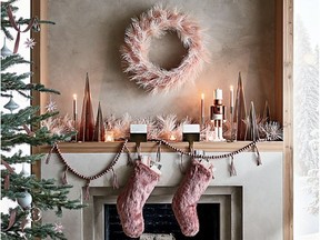 Colours of soft pink, plum and burgundy lend a feminine decorating touch this holiday season. Faux Fur Dusty Rose Stocking, CB2.com