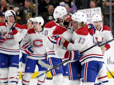 Nate Thompson #44 and Max Domi #13 of the Montreal Canadiens celebrate after Domi scored a goal in overtime to beat the Vegas Golden Knights 5-4 during their game at T-Mobile Arena on October 31, 2019 in Las Vegas, Nevada.