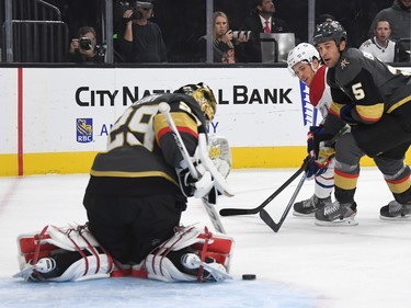 Marc-Andre Fleury #29 of the Vegas Golden Knights blocks a shot by Nick Cousins #21 of the Montreal Canadiens.