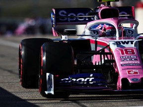 Lance Stroll of Montreal drivies the (18) Racing Point RP19 Mercedes in the pit lane during qualifying for the F1 Grand Prix of USA at Circuit of The Americas on Saturday, Nov. 2, 2019, in Austin, Tex.