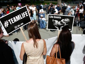Pro-life activists gather outside the U.S. Supreme Court on June 26, 2014, in Washington, D.C.