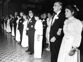 Seventeen-year-old Betsy Wells, right, on the arm of her uncle Dr. John MacDonald, stands with the other debutantes and fathers at St. Mary's Ball in Montreal on Nov. 19, 1982. This photo was published on Nov. 22, 1982.
