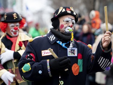 Clowns from the Shriner's Circus entertain the crowd during the annual Santa Claus parade in Montreal on Saturday, Nov. 23, 2019.