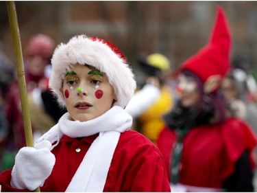 One of Santa's helpers takes part in the annual Santa Claus parade in Montreal on Saturday, Nov. 23, 2019.