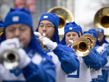 Performers of Falun Dafa take part in the annual Santa Claus parade in Montreal on Saturday, Nov. 23, 2019.