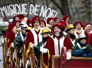 Choeur en Fugue de Châteauguay sings to the crowd during the annual Santa Claus parade in Montreal on Saturday, Nov. 23, 2019.