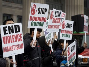 Members of Montreal's Muslim community protest on Sunday, Nov. 24, 2019, in Montreal to decry the recent burning of the Qur'an in Norway.