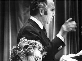 Consumer and Corporate Affairs Minister Warren Allmand of the federal Liberal party addresses a Montreal audience on Nov. 30, 1978 on the subject of Ottawa's proposed constitutional amendment bill, C-60. In the foreground is debate participant Winifred Potter of the Progressive Conservatives.(The uncropped photo appears with the text.)