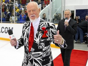 Don Cherry and Ron MacLean of Hockey Night in Canada walk to centre ice as the Buffalo Sabres take on the Ottawa Senators at J.L. Grightmire Arena on Sept. 28, 2010 in Dundas, Ont.