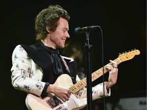 NEW YORK, NY - JUNE 21:  Harry Styles plays a guitar with the words "End Gun Violence" as he performs onstage during Harry Styles: Live On Tour - New York at Madison Square Garden on June 21, 2018 in New York City.