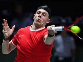 Canada's Denis Shapovalov returns the ball to Spain's Rafael Nadal during the final singles tennis match between Canada and Spain at the Davis Cup Madrid Finals 2019 in Madrid on Sunday, Nov. 24, 2019.