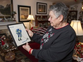 Beverly Maki, widow of Wayne Maki, with needlepoint of the late Vancouver Canucks winger that was given to her by a fan of the team.