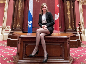 Québec solidaire MNA Catherine Dorion sits on a desk in the Salon rouge at the National Assembly in Quebec City, in a photo she posted to Facebook on Halloween. The photo created controversy among legislators for what they called a lack of respect for the chamber.