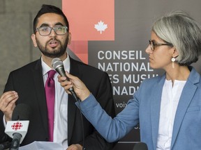 Members of the National Council of Canadian Muslims Mustafa Farooq, left, and Bochra Mana speak during a news conference in Montreal, Monday, June 17, 2019. Opponents of Quebec's secularism law are in court today making their case in front of the province's highest court.