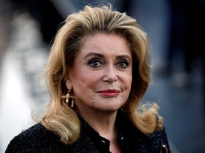 Catherine Deneuve arrives for the fashion house Saint Laurent's show during Paris Fashion Week in Paris, France, Sept. 25, 2018.