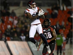 Montreal Alouettes wide receiver Eugene Lewis (87) catches the ball for a touchdown in front of Ottawa Redblacks defensive back Brandin Dandridge (38) during first half CFL football action in Ottawa on Friday, Nov. 1, 2019.