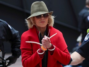 Actress Jane Fonda is arrested by U.S. Capitol Police officers during a "Fire Drill Fridays" climate change protest inside the Hart Senate Office Building on Capitol Hill in Washington, D.C., on Friday, Nov. 1, 2019.