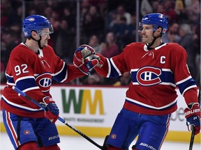 Canadiens defenceman Shea Weber, right, reacts with teammate Jonathan Drouin after scoring a goal against the Los Angeles Kings during the first period at the Bell Centre in Montreal on Saturday, Nov. 9, 2019.