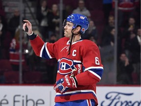 Canadiens captain Shea Weber throws pucks to fans after scoring two power-play goals and being named the first star after a 3-2 win over the Los Angeles Kings in NHL action on Nov. 9, 2019, at the Bell Centre in Montreal.