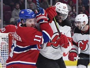Montreal Canadiens forward Brendan Gallagher and New Jersey Devils defenceman P.K. Subban battle in front of the net during the third period at the Bell Centre on Nov. 16, 2019.