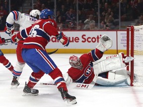 Canadiens goaltender Carey Price makes a save against New York Rangers defenceman Jacob Trouba as Jeff Petry defends during the second period at the Bell Centre in Montreal on Saturday, Nov. 23, 2019.