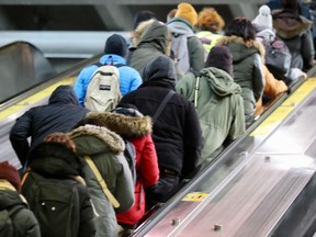 Commuters pack escalator in the Lionel-Groulx métro station after not being able to transfer to the Orange Metro line during a shutdown Nov. 14, 2019.