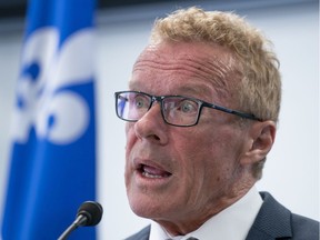 Quebec Labour Minister Jean Boulet responds to a question during a news conference in Montreal on August 26, 2019.