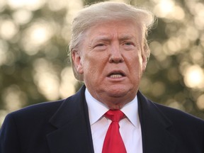 U.S. President Donald Trump speaks to reporters as he departs for travel to Lexington, Kentucky from the South Lawn of the White House in Washington, U.S., Nov. 4, 2019.