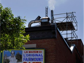 A mix of smoke and vapour exits the chimney at Fairmount Bagel. Neighbours say the filtration device used at Fairmount, where ovens burn 24 hours a day, breaks down regularly — a claim Fairmount's owner denies.