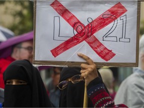 A sign is held at an anti-Bill 21 rally organized by teachers in Montreal in September 2019.