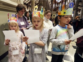 Melody and Emma Pennings and Bryn Hurtubise sing during a Messy Cathedral event at Christ Church Cathedral, which included everything from crown-making stations to bowling.