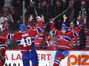 Canadiens' Ben Chiarot celebrates his winning goal in overtime with teammate Joel Armia during game against the Senators this month.