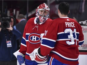 Carey Price congratulates rookie goalie Cayden Primeau after his first NHL victory, a 3-2 overtime win over the Ottawa Senators at the Bell Centre in Montreal on Dec. 11, 2019.