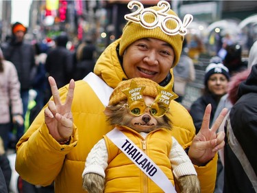 People arrive in the morning to celebrate New Year's Eve in Times Square on December 31, 2019 in New York City. Because of the mild weather, a larger than usual crowd of people visiting from all over the world is expected to watch the ball drop.