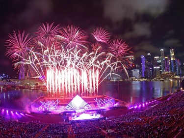Singapore awaits 2020 with curtain-raiser fireworks by Star Island as revellers join in the biggest countdown celebration at Marina Bay on December 31, 2019 in Singapore.