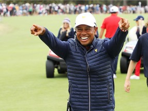 Playing Captain Tiger Woods of the United States team celebrates after clenching the Presidents Cup during Sunday Singles matches on day four of the 2019 Presidents Cup at Royal Melbourne Golf Course on Saturday, Dec. 15, 2019, in Melbourne, Australia.