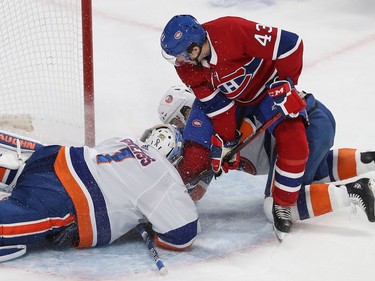 Montreal's Jordan Weal (43) goes in on net of New York Islanders goaltender Thomas Greiss, with left wing Michael Dal Colle (28), during first period NHL action in Montreal on Tuesday December 03, 2019.