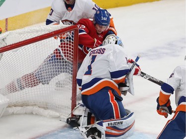 Habs forward Artturi Lehkonen (62) goes in on New York Islanders goaltender Thomas Greiss as New York Islanders' Derick Brassard (10) comes in on play, during first period NHL action in Montreal on Tuesday December 03, 2019.