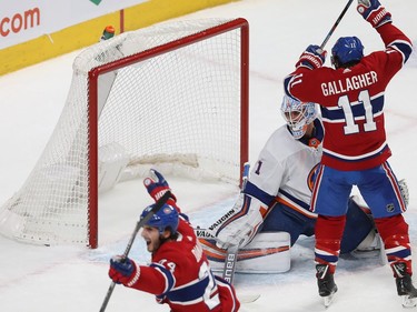 Montreal forward Phillip Danault (24) celebrates his goal with teammate Brendan Gallagher (11) during first period NHL action in Montreal on Tuesday December 03, 2019.