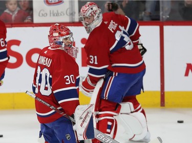 Starting Montreal Canadiens goaltender Cayden Primeau skates towards the net passing Carey Price during warmup session before game  against the Colorado Avalanche, in NHL action in Montreal on starting December 05, 2019.