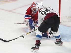 Canadiens goaltender Cayden Primeau stops shot Avalanche's Mikko Rantanen from close-in during the third period at the Bell Centre Thursday night.
