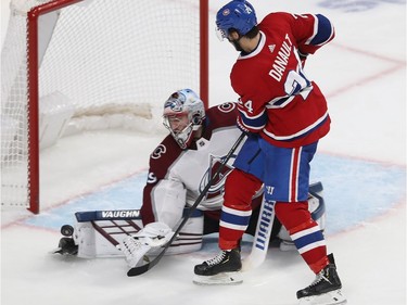 Phillip Danault (24) watches puck deflect off the pad of Colorado Avalanche's Pavel Francouz during third period NHL action in Montreal on Thursday December 05, 2019.