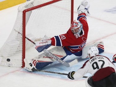 Montreal Canadiens goaltender Cayden Primeau does the splits as he stop the shot from Colorado Avalanche's Gabriel Landeskog (92) during second period NHL action in Montreal on Thursday December 05, 2019.