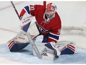 Montreal Canadiens goaltender Cayden Primeau stops puck on shot by Colorado Avalanche player, during first period NHL action in Montreal on Thursday December 05, 2019.