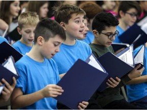 A group of boys take part in Les Petits Chanteurs de Laval rehearsal in Laval in 2018.