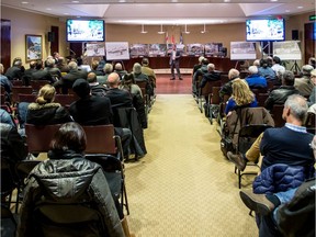 A crowd attends the presentation of development project for the former Merck Frosst site at Kirkland city hall, on Nov. 24, 2015. Because of objections from residents through a register, the project was then scuttled.