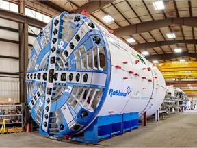 The tunnel boring machine  is 100 metres long and includes several specialized machines, a belt conveyor, a cockpit and about 10 workers inside.