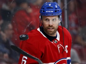Canadiens captain Shea Weber flips puck in the air with his stick during pregame warmup before facing the Ottawa Senators in NHL game at the Bell Centre in Montreal on Dec. 11, 2019.