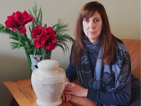 Pamela MacDonald with the ashes of her late uncle, Donald G. MacDonald.