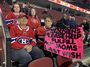 Theresa Martell, bottom left, with her daughter Denise Martell and granddaughters Breanne and Kailey, watches the Canadiens' morning skate at the Saddledome in Calgary. Credit: Stu Cowan/Montreal Gazette.